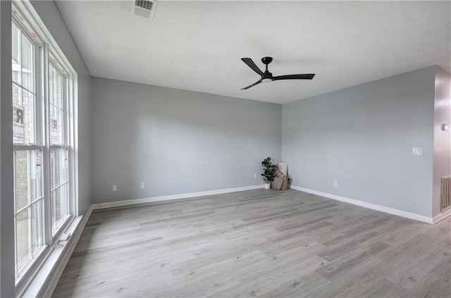 128 Evergreen Trl Unit 4, Cartersville, GA 30121 - spare room with plenty of natural light, wood finished floors, ceiling fan, a textured ceiling, and baseboards