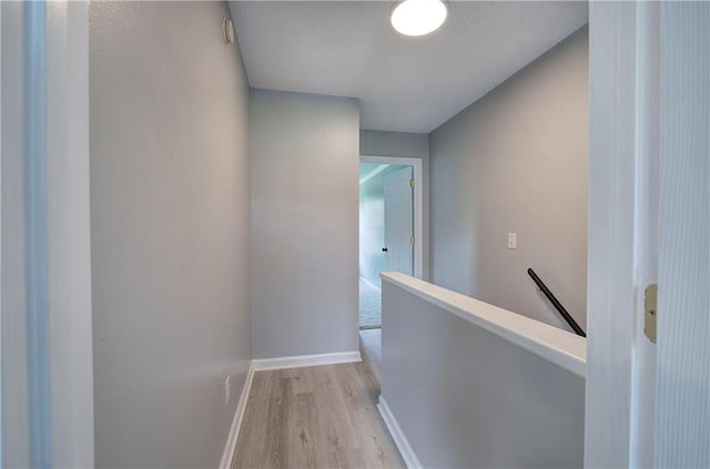 128 Evergreen Trl Unit 4, Cartersville, GA 30121 - hall with an upstairs landing, light wood-style flooring, and baseboards