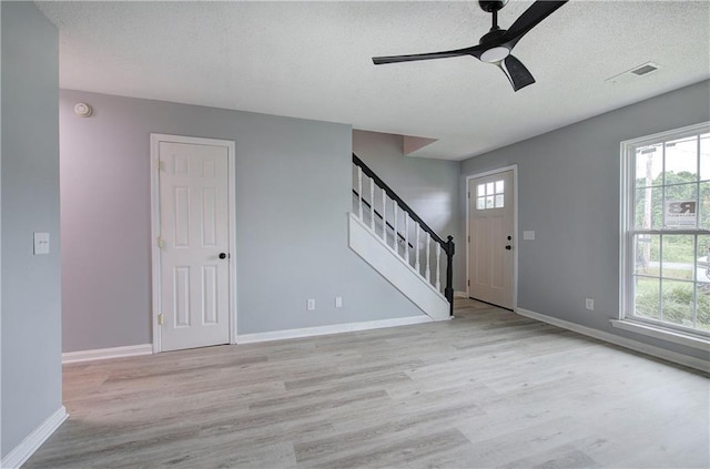 128 Evergreen Trl Unit 4, Cartersville, GA 30121 - entrance foyer with a ceiling fan, stairs, light wood finished floors, a textured ceiling, and baseboards