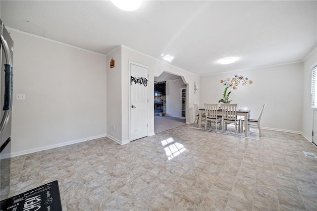 unfurnished dining area featuring ornamental molding