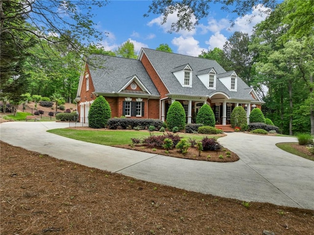 view of front facade featuring a garage and a front lawn