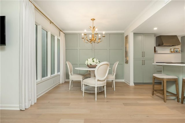 39 Ivy Gates NE, Atlanta, GA 30342 - dining room with a chandelier, crown molding, a decorative wall, and light wood-style flooring