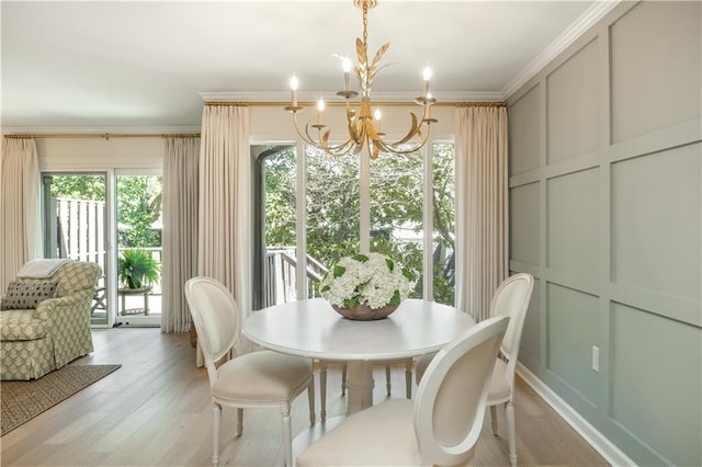 39 Ivy Gates NE, Atlanta, GA 30342 - dining room with a chandelier, a decorative wall, light wood finished floors, and crown molding
