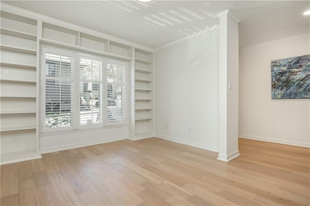 39 Ivy Gates NE, Atlanta, GA 30342 - empty room featuring light wood-style floors, baseboards, and built in shelves