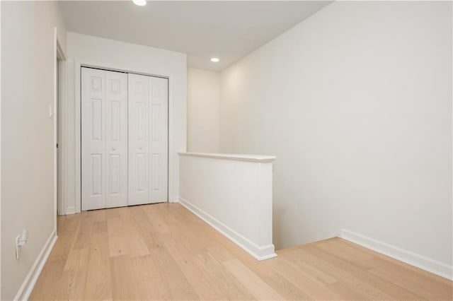 39 Ivy Gates NE, Atlanta, GA 30342 - unfurnished bedroom featuring a closet, recessed lighting, light wood-type flooring, and baseboards