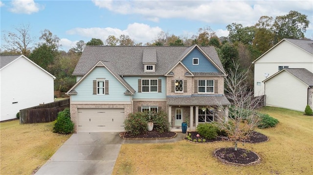 view of front of home featuring a garage and a front yard