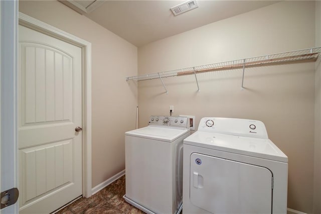 clothes washing area featuring washing machine and clothes dryer