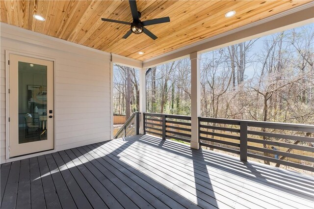 wooden terrace featuring ceiling fan