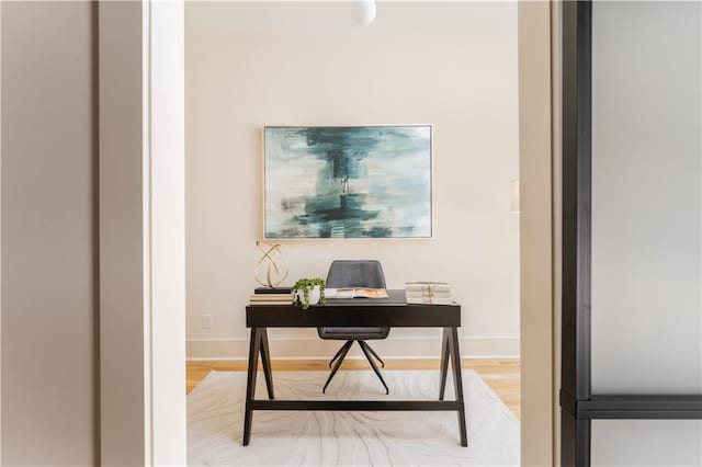 office area featuring wood finished floors and baseboards