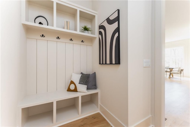 mudroom with light wood-style flooring