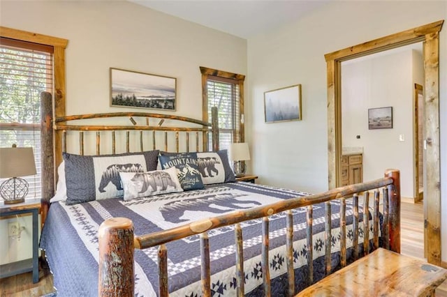 bedroom with wood finished floors