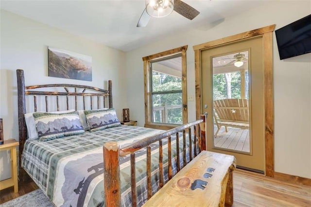 bedroom featuring ceiling fan, baseboards, and wood finished floors