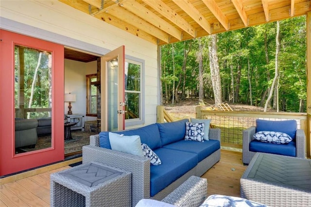 view of patio featuring an outdoor living space and a wooden deck