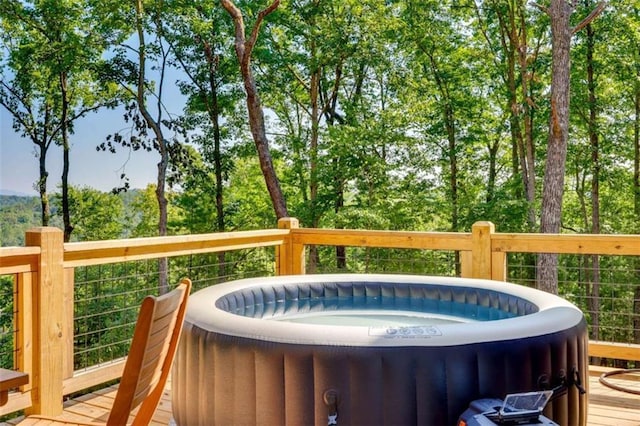 wooden terrace with a hot tub