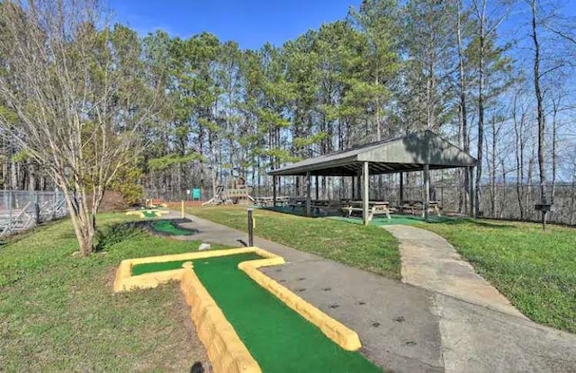 view of home's community featuring a yard, a gazebo, and fence