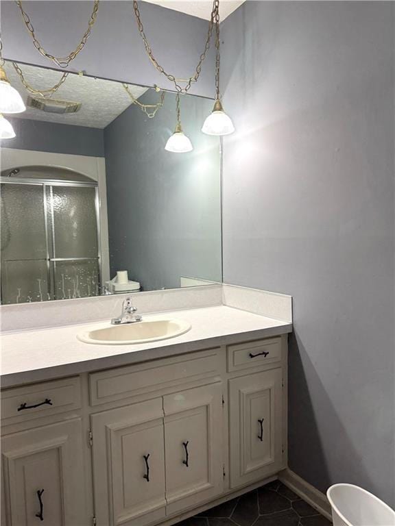 bathroom with tile patterned flooring and vanity