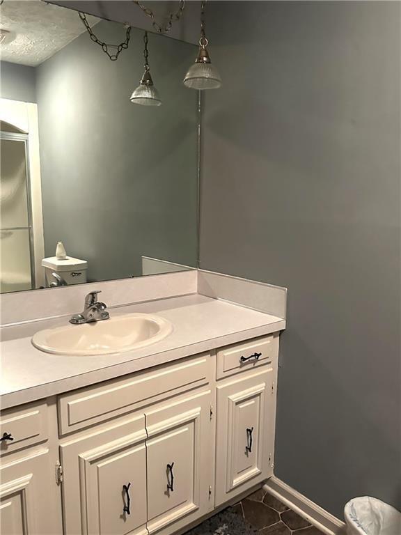 bathroom featuring tile patterned floors and vanity