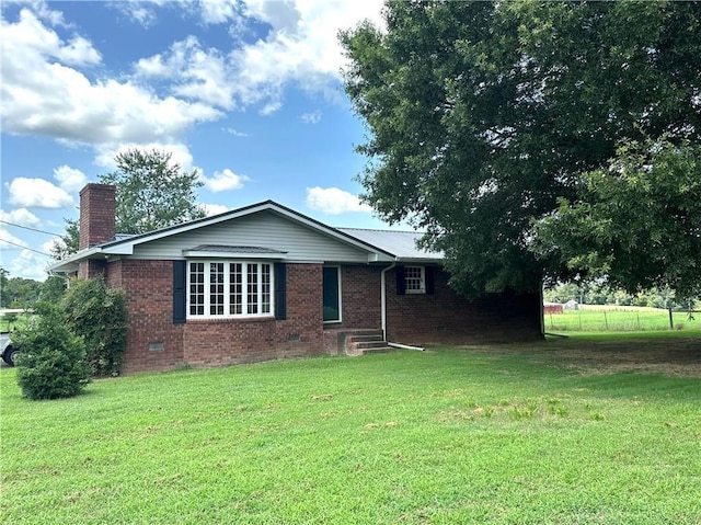 ranch-style home with a front yard