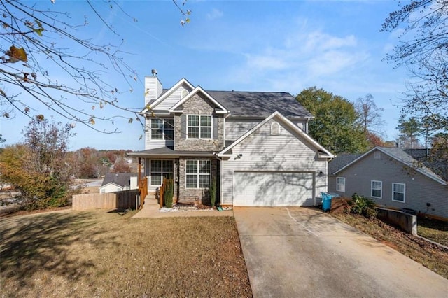 view of front facade featuring a garage and a front lawn