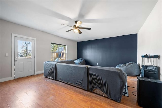 bedroom with hardwood / wood-style floors and ceiling fan