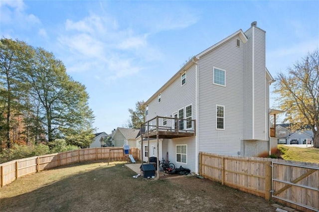 rear view of house with a yard and a patio