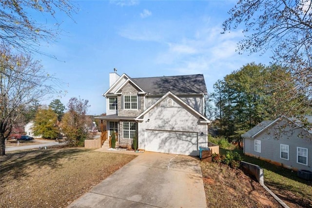 view of front of home featuring a garage and a front lawn