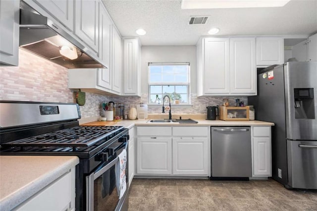 kitchen featuring white cabinetry, stainless steel appliances, and sink