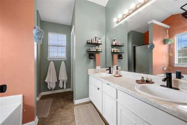 bathroom featuring plenty of natural light, separate shower and tub, and vanity