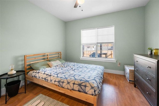 bedroom featuring ceiling fan and light hardwood / wood-style flooring