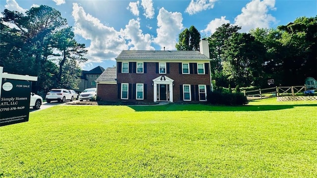 1391 Warrenton Hunt, Lawrenceville, GA 30043 - colonial inspired home featuring a chimney and brick siding