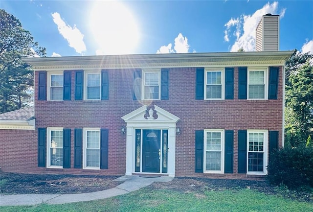 1391 Warrenton Hunt, Lawrenceville, GA 30043 - colonial inspired home with a chimney and brick siding