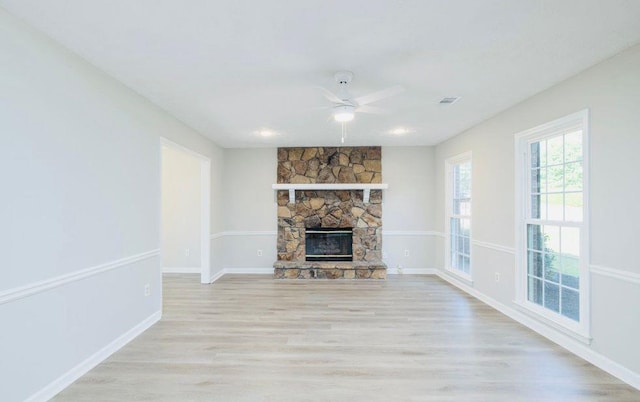1391 Warrenton Hunt, Lawrenceville, GA 30043 - unfurnished living room featuring a ceiling fan, light wood finished floors, and a fireplace