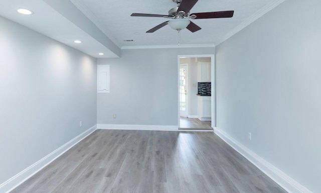 1391 Warrenton Hunt, Lawrenceville, GA 30043 - empty room featuring light wood-style flooring, crown molding, ceiling fan, and recessed lighting
