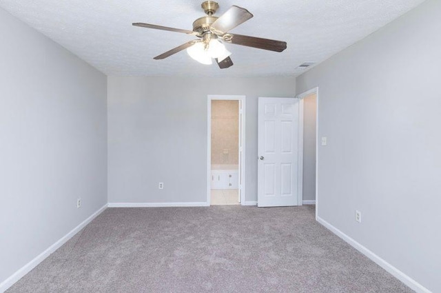 1391 Warrenton Hunt, Lawrenceville, GA 30043 - unfurnished bedroom with carpet flooring, a textured ceiling, ensuite bathroom, and a ceiling fan