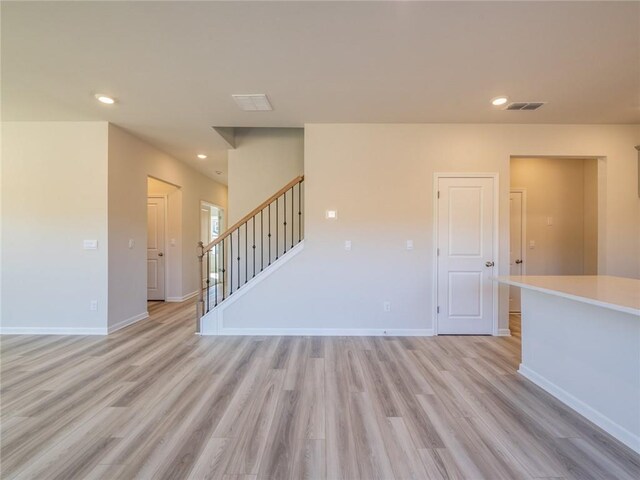 spare room featuring light wood-type flooring