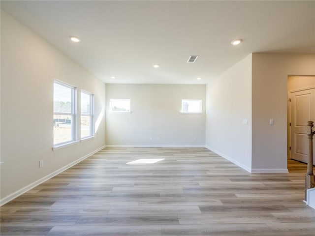 spare room featuring light wood-type flooring