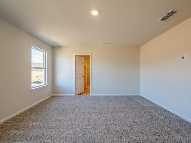 view of carpeted spare room