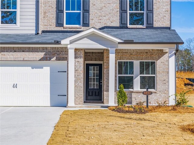 property entrance featuring a garage