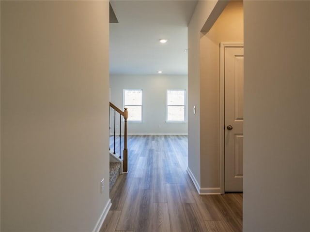 hall with hardwood / wood-style flooring