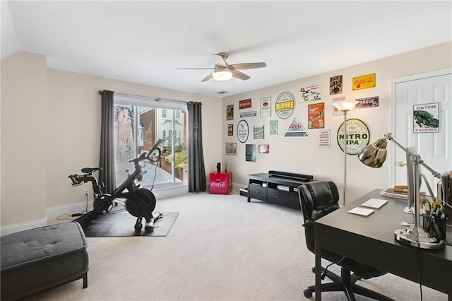 home office with ceiling fan and carpet