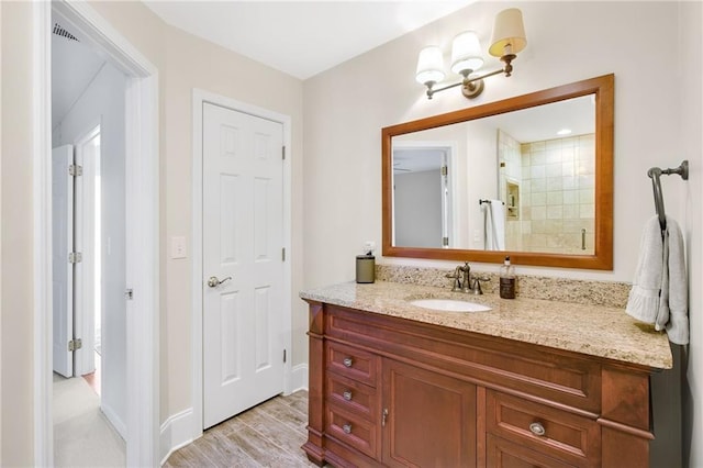 bathroom featuring hardwood / wood-style floors and vanity