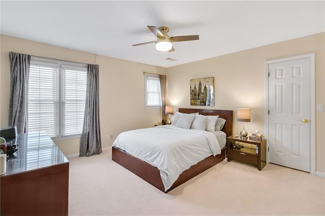 carpeted bedroom with ceiling fan