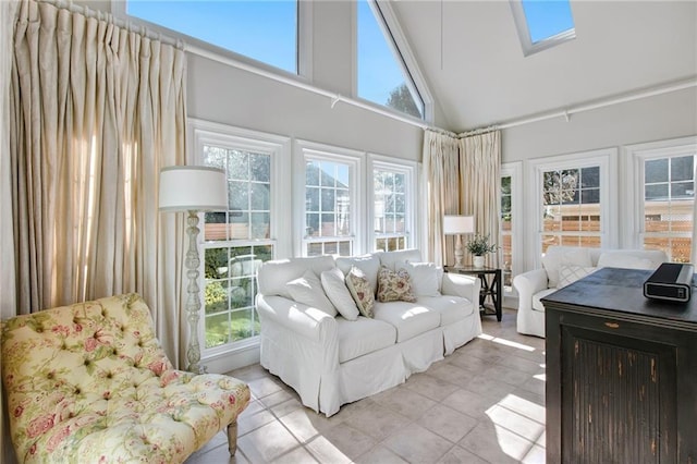 sunroom / solarium featuring lofted ceiling with skylight