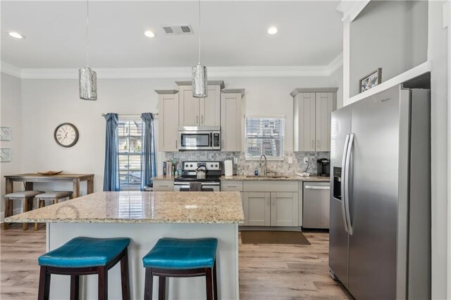 906 Sims St SW, Atlanta, GA 30603 - kitchen with a sink, decorative backsplash, appliances with stainless steel finishes, and visible vents