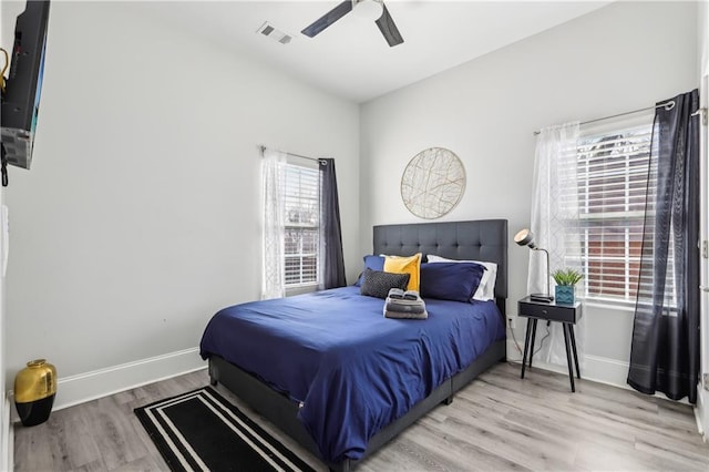 906 Sims St SW, Atlanta, GA 30603 - bedroom with a ceiling fan, wood finished floors, visible vents, and baseboards