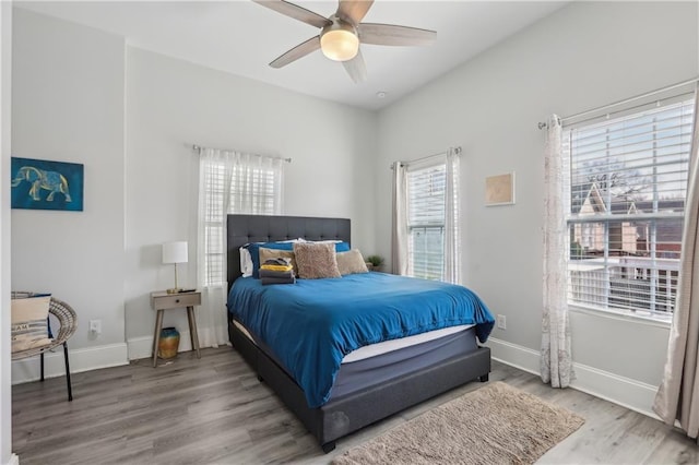 906 Sims St SW, Atlanta, GA 30603 - bedroom featuring baseboards, wood finished floors, and a ceiling fan