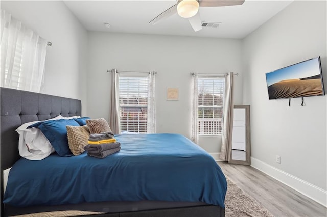 906 Sims St SW, Atlanta, GA 30603 - bedroom featuring visible vents, a ceiling fan, baseboards, and wood finished floors