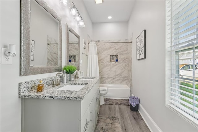 906 Sims St SW, Atlanta, GA 30603 - bathroom with a sink, toilet, wood finished floors, and shower / bath combination with curtain