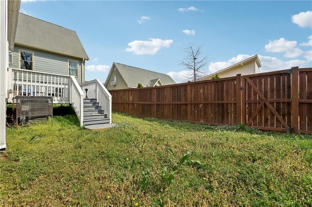 906 Sims St SW, Atlanta, GA 30603 - view of yard featuring a deck, stairs, and fence