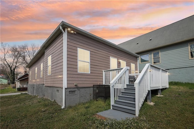 906 Sims St SW, Atlanta, GA 30603 - back of house at dusk featuring a deck, a yard, stairs, and crawl space